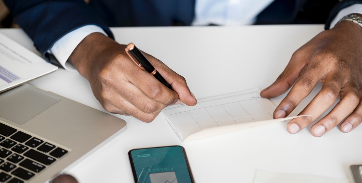 weekly financial management person working at desk