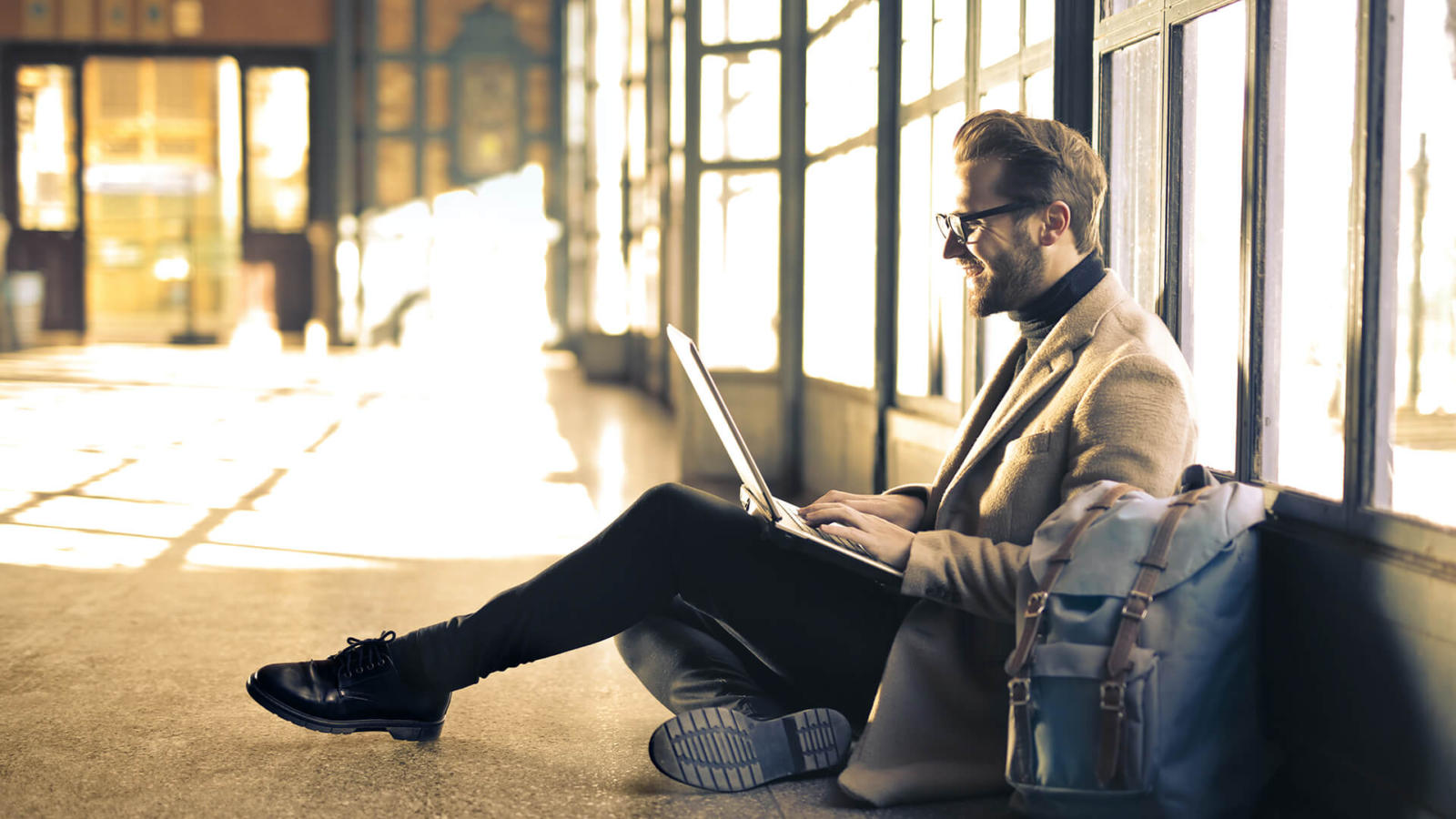 A traveling employee working from a laptop increases his efficiency